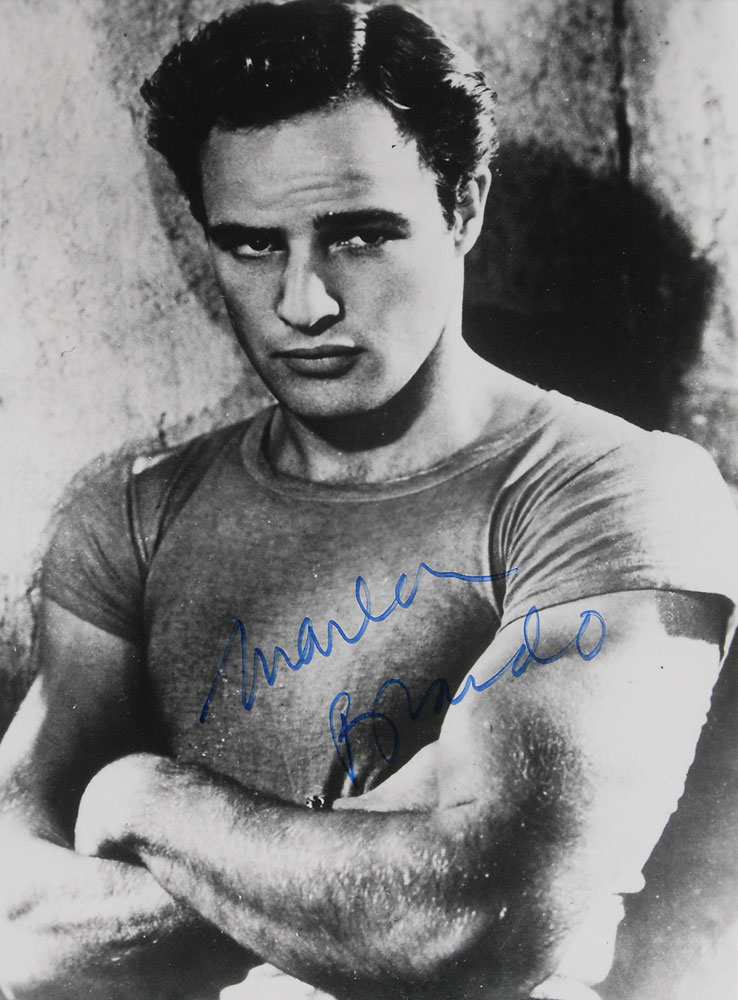 A photo of young Brando in the film adaptation of A Streetcar Named Desire signed in blue felt tip.