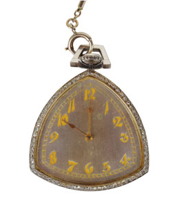 The front of Al Capone's diamond studded pocket watch. The face is made of platinum and has gold-tone impressed numerals and watch hands. This watch sold for $84,375 in June 2017.