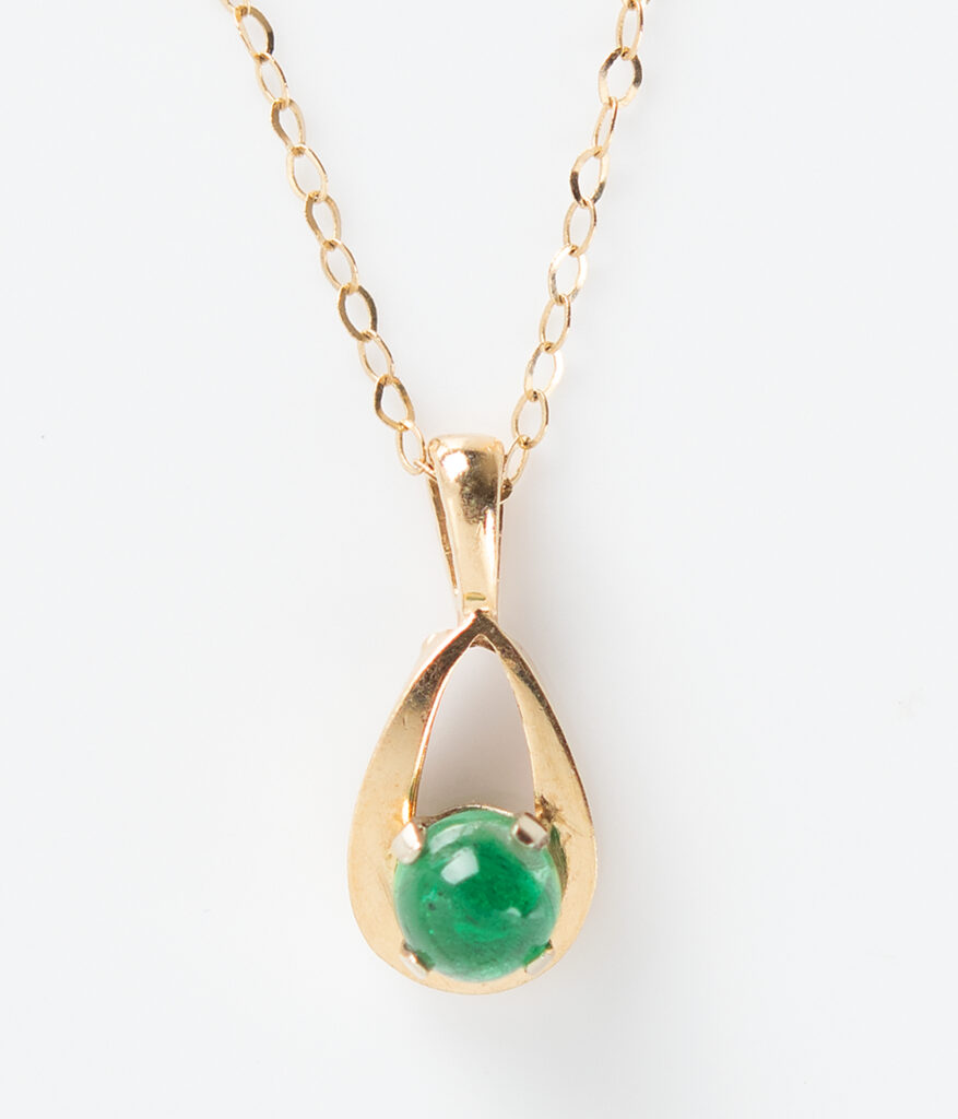 A 14-karat gold necklace with an emerald was given by Elon Musk to his college girlfriend, Jennifer Gwynne. It sold for $51,000 at auction.