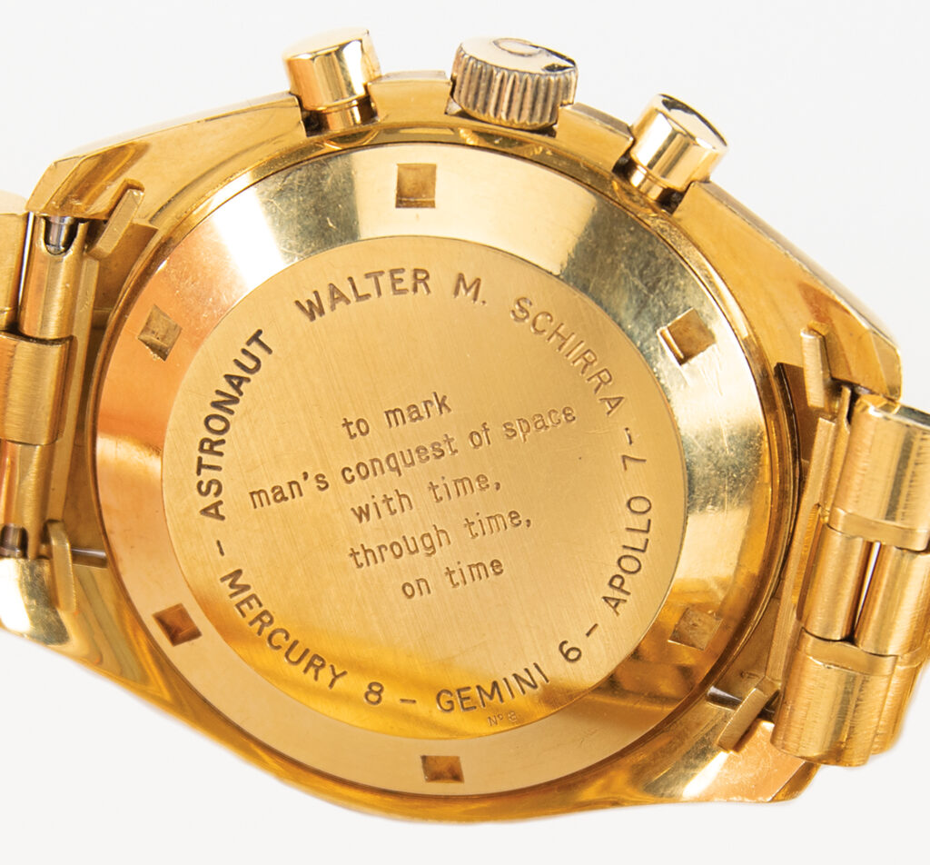 The back of Wally Schirra's chronograph engraved with his name, missions, and a quote that reads "To mark man's conquest of space with time, through time, on time."