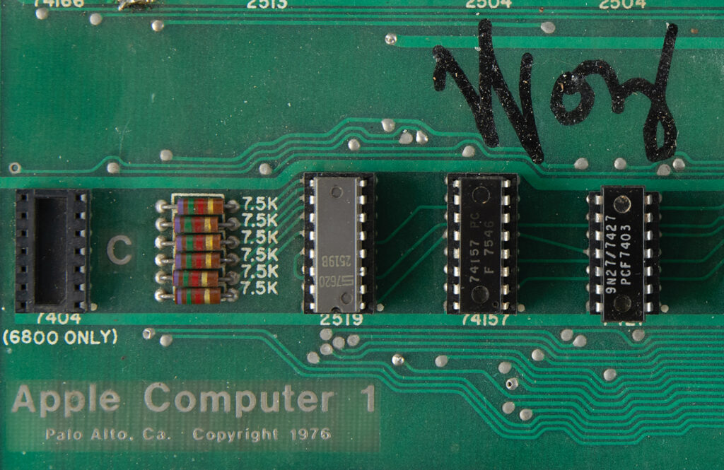 Steve Wozniak's signature using his nickname 'Woz' on the Apple-1 circuit board.
