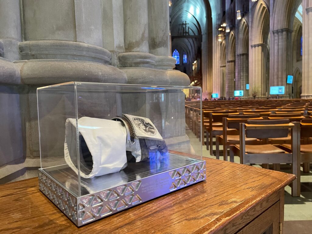 Gene Cernan's flown lunar cuff displayed in its protective case at Washington D.C.'s National Cathedral.