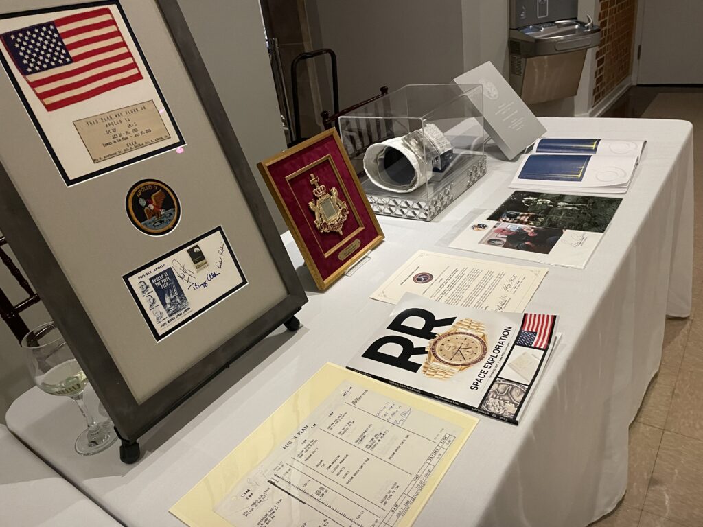 Along with cuff, other artifacts from astronaut history including a flown Bible and a page from the Apollo 11 landing checklist.