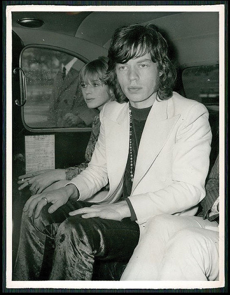 Lead vocalist Mick Jagger wearing the velvet trousers in the back of a day out.