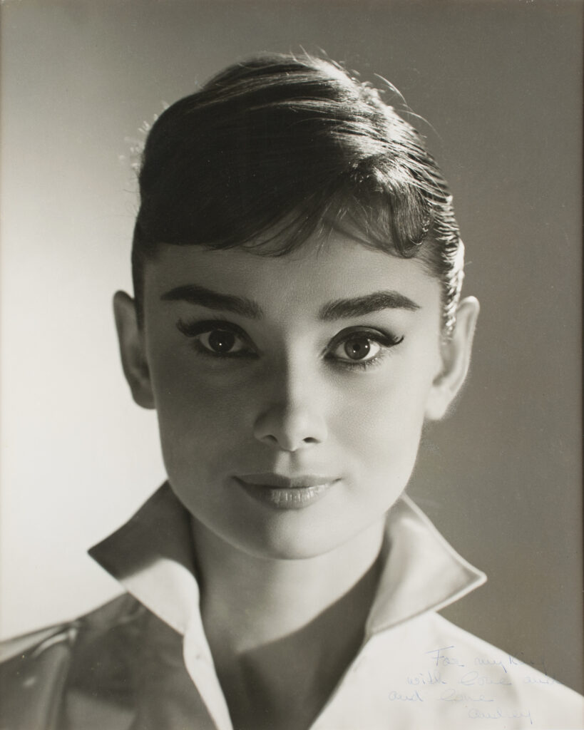 A 1956 black and white portrait showcasing Hepburn's striking stare and her faded inscription in the bottom right corner. This lot ended up selling for $17,500.