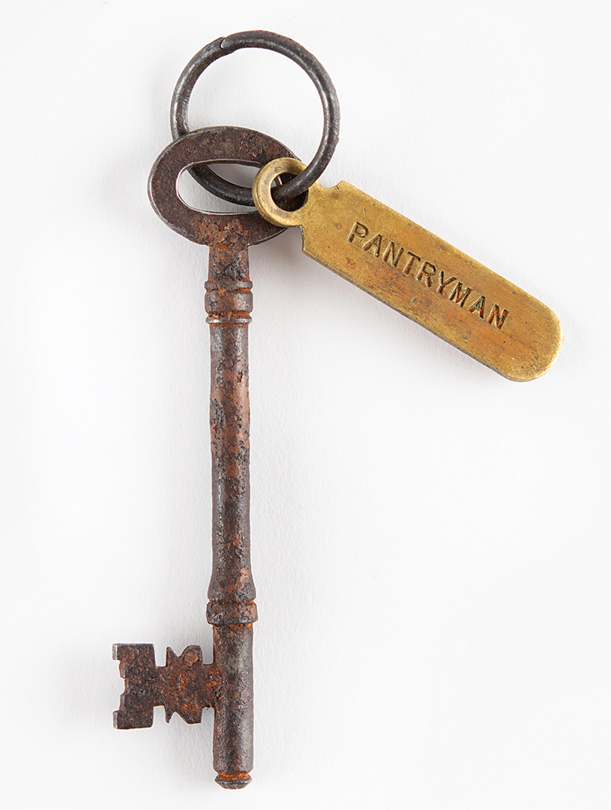 Close-up of the rusty Titanic key recovered from Deeble’s body, featuring the metallic tag that says “Pantryman.”
