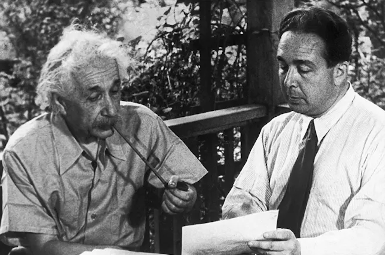 Physicists Albert Einstein (left) and Leo Szilard (right) review their letter to FDR about the potential for Nazi Germany to build atomic bombs. Photograph is from the National Park Service.