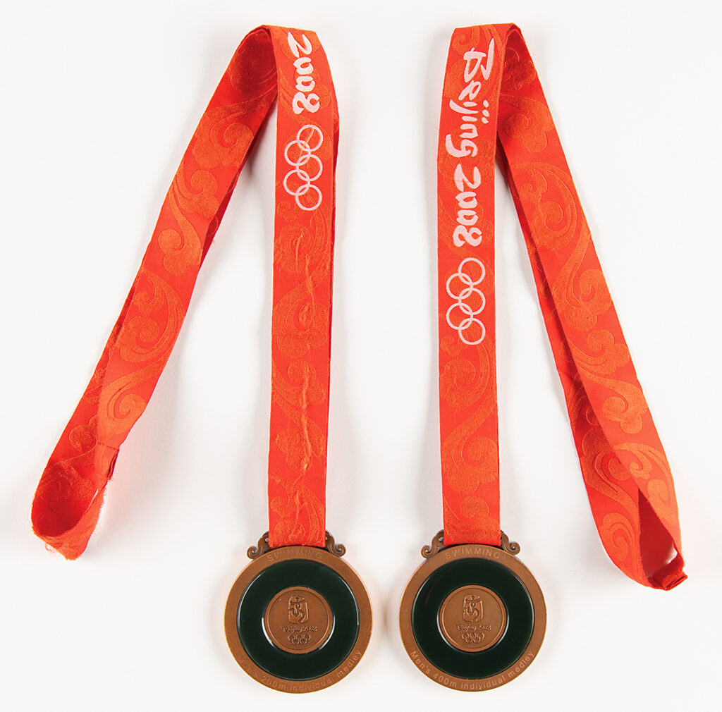 Ryan Lochte's bronze medals from the Beijing 2008 Olympics games. The reverse of the medals are inlaid with jade.