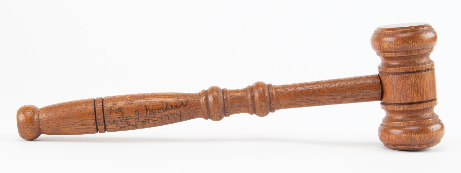 Pete Rodino’s gavel used during the impeachment hearings of President Nixon, featuring his inscription to Carlos Moorhead on its handle.
