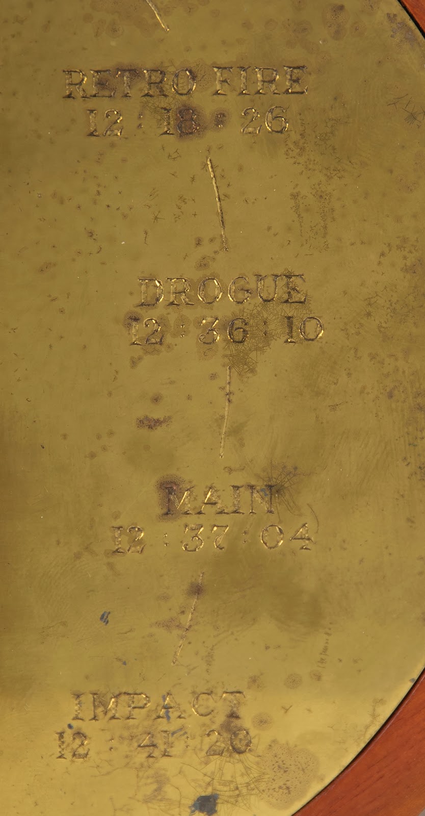 A close-up on the latter half of the flight timeline on the right of the clock’s gold face, chronicling the time of impact as, “12:41:20.”