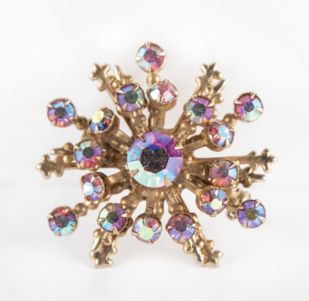 Prince’s secondary stage-worn snowflake-shaped brooch worn during rehearsals for his 1985 AMA performance.