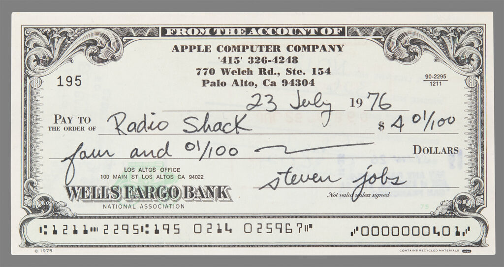 Check filled out and signed by Steve Jobs to RadioShack for $4.01. The check contains the Apple Computer Company header with their original phone number, “‘415’ 326-4248,” and address, “770 Welch Rd. Ste. 154, Palo Alto, Ca 94304.”