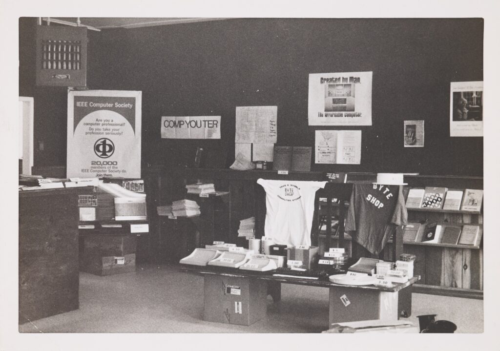 Byte Shop store display with IEEE Computer Society poster and Byte Shop t-shirts